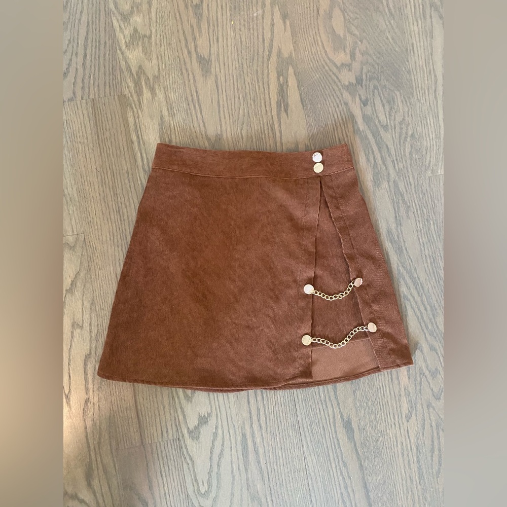 Brown corduroy skirt with gold chain accents